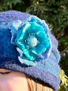 Felted beanie with beaded flower brooch pin